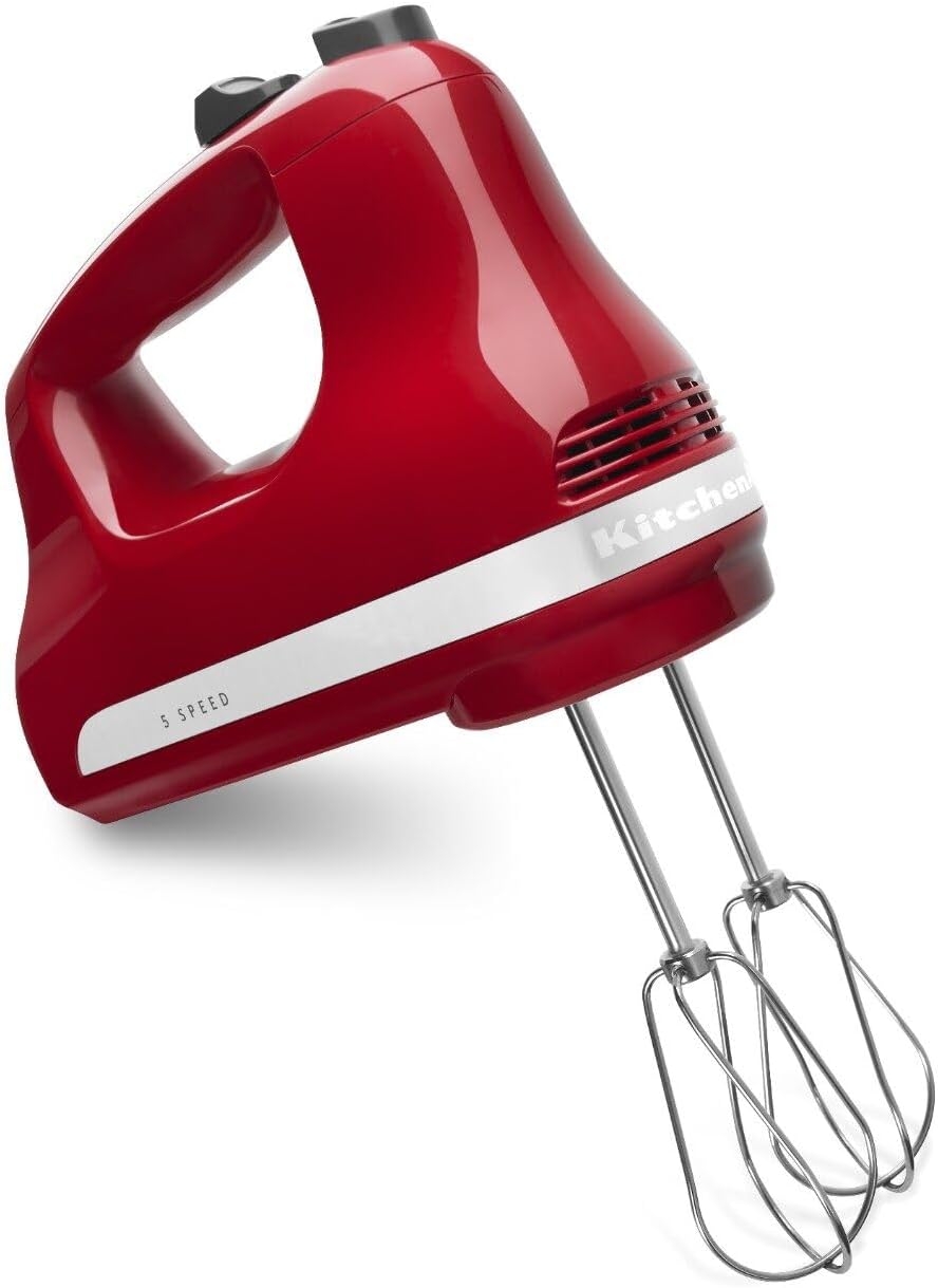 KitchenAid KHM512 Empire Red hand mixer shown at an angle with top controls and two attached Turbo Beaters.