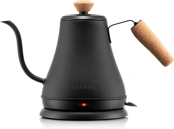 Black electric kettle with wooden accents on a white background