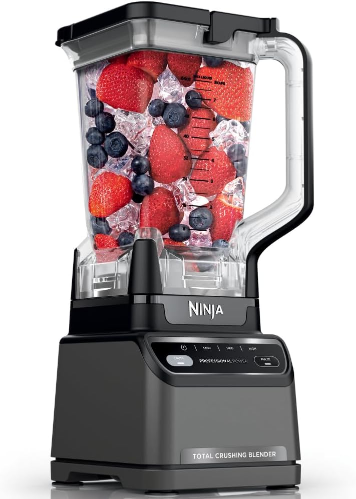 Ninja Professional Blender 2.0 with a clear handled pitcher filled with strawberries, blueberries and ice